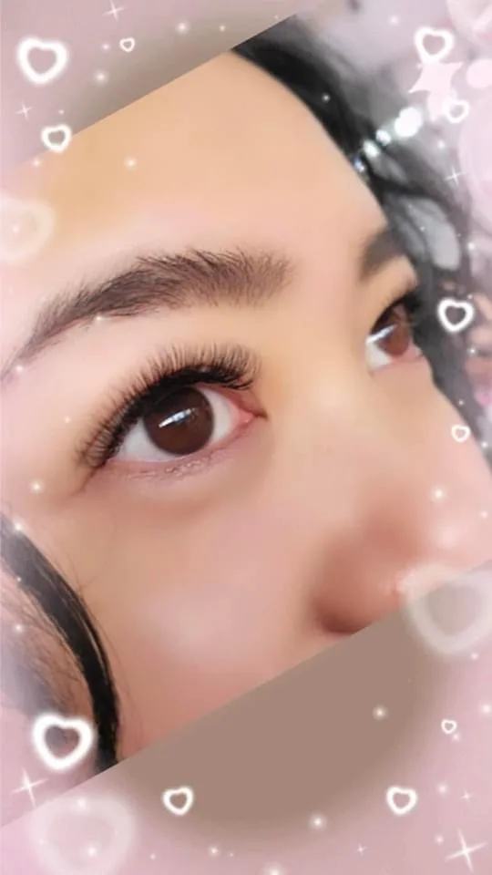 Lash-extension close-up with sparkle overlay graphics