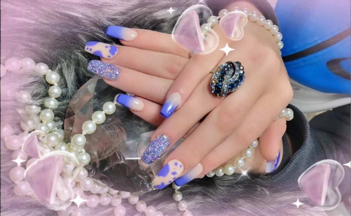 Blue and glitter ombre coffin nails with sparkle graphics